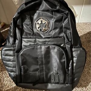 Sleek Black and Silver Backpack with Modern Design